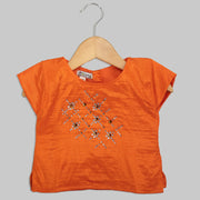 Orange Blouse with Swarovski Work and Beige Jacquard Ghaghra